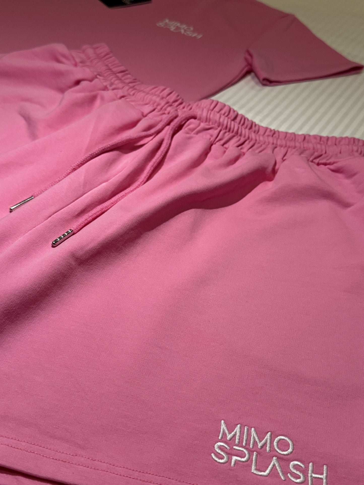 Woman's pink colour fitness slim crop top with shorts.